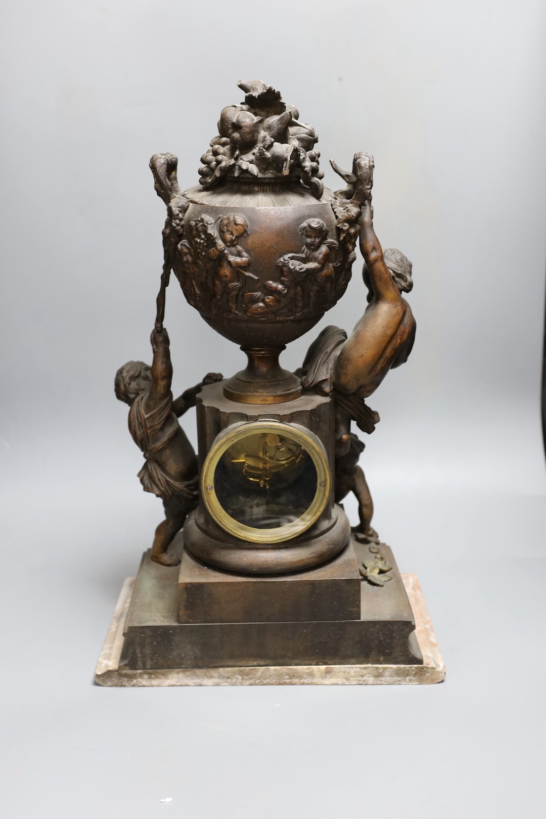 An early 20th century French bronzed spelter cherubic mantel clock 52cm